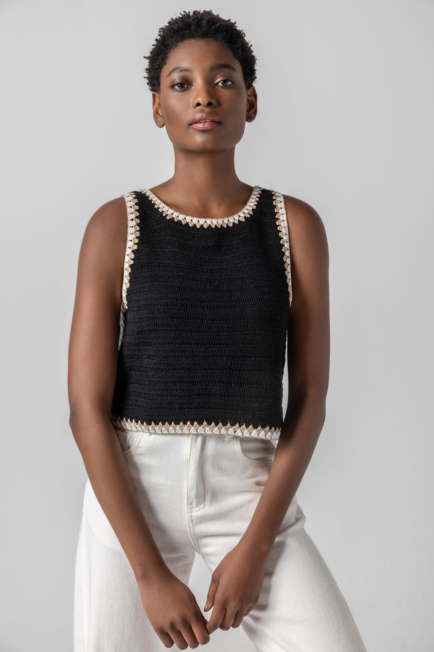 <p>Our multicolor Crochet Tank is a truly special piece, hand-crocheted by artisans in India. With its slightly shorter length, it pairs perfectly with our Air Textured Cotton bottoms, creating a balanced and effortless summer look. Thoughtfully crafted and full of detail, this tank adds a unique touch to your warm-weather wardrobe.</p> Womens Top Black A5