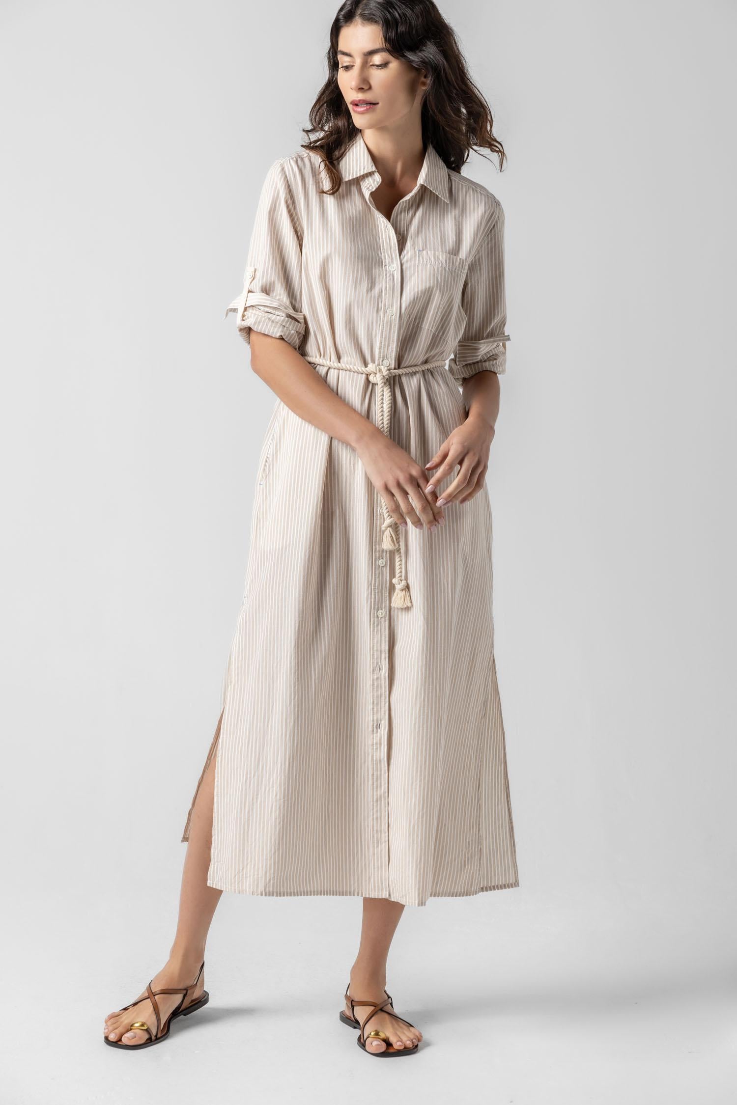 <p>In crisp poplin, the Striped Maxi Shirt Dress offers versatility and effortless ease. Designed with tabs on the sleeves, it can be worn rolled up or down to suit your mood. With tall side slits and a full button-down front, this dress can double as a duster over shorts or white denim for added styling options. An optional natural rope belt allows you to wear it cinched or loose, making it a perfect choice for summer days and beyond.</p> Womens Dress Flax Stripe A1