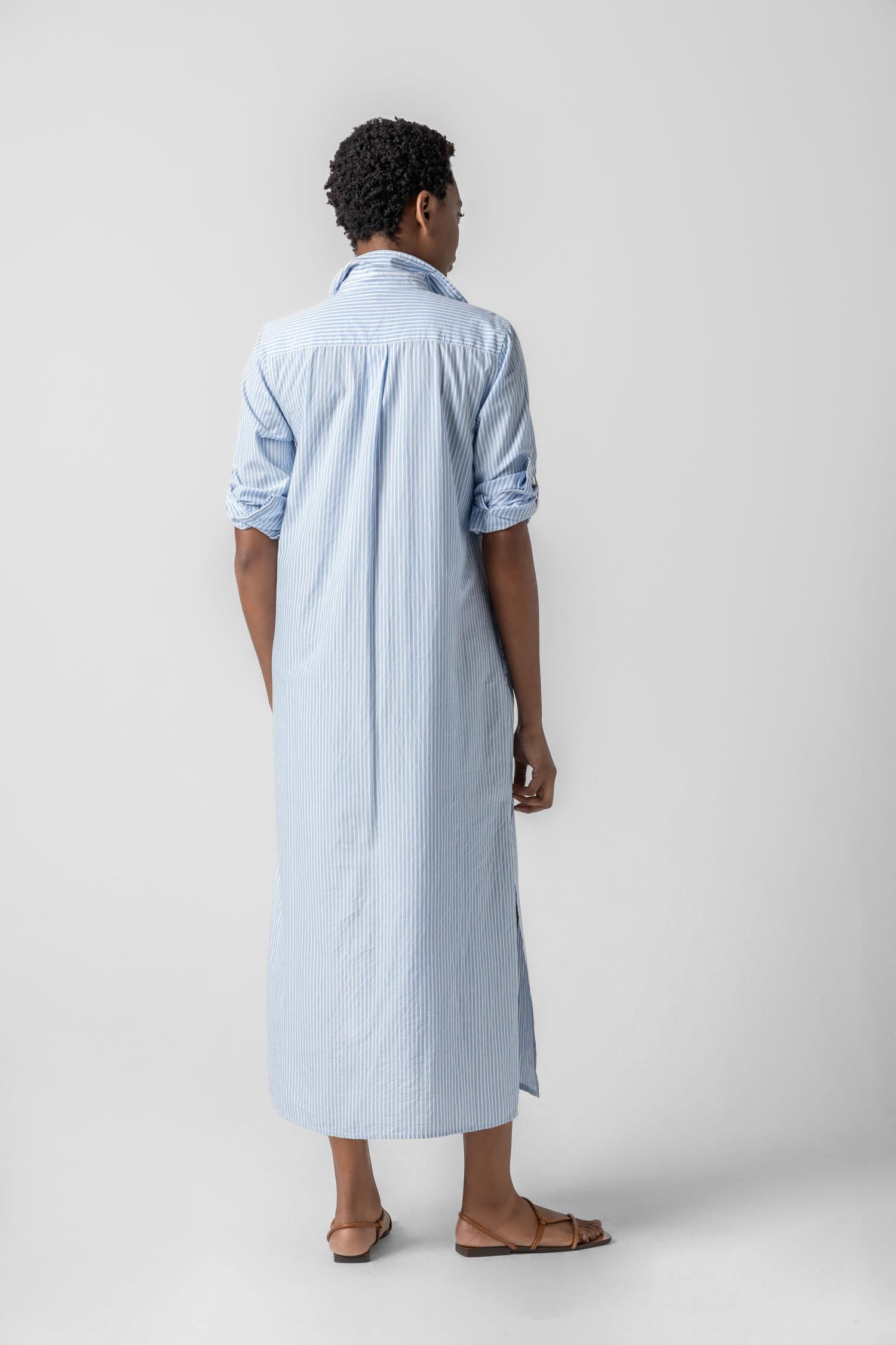 <p>In crisp poplin, the Striped Maxi Shirt Dress offers versatility and effortless ease. Designed with tabs on the sleeves, it can be worn rolled up or down to suit your mood. With tall side slits and a full button-down front, this dress can double as a duster over shorts or white denim for added styling options. An optional natural rope belt allows you to wear it cinched or loose, making it a perfect choice for summer days and beyond.</p> Womens Dress Malibu Stripe A2