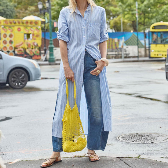 <p>In crisp poplin, the Striped Maxi Shirt Dress offers versatility and effortless ease. Designed with tabs on the sleeves, it can be worn rolled up or down to suit your mood. With tall side slits and a full button-down front, this dress can double as a duster over shorts or white denim for added styling options. An optional natural rope belt allows you to wear it cinched or loose, making it a perfect choice for summer days and beyond.</p> Womens Dress Malibu Stripe C3