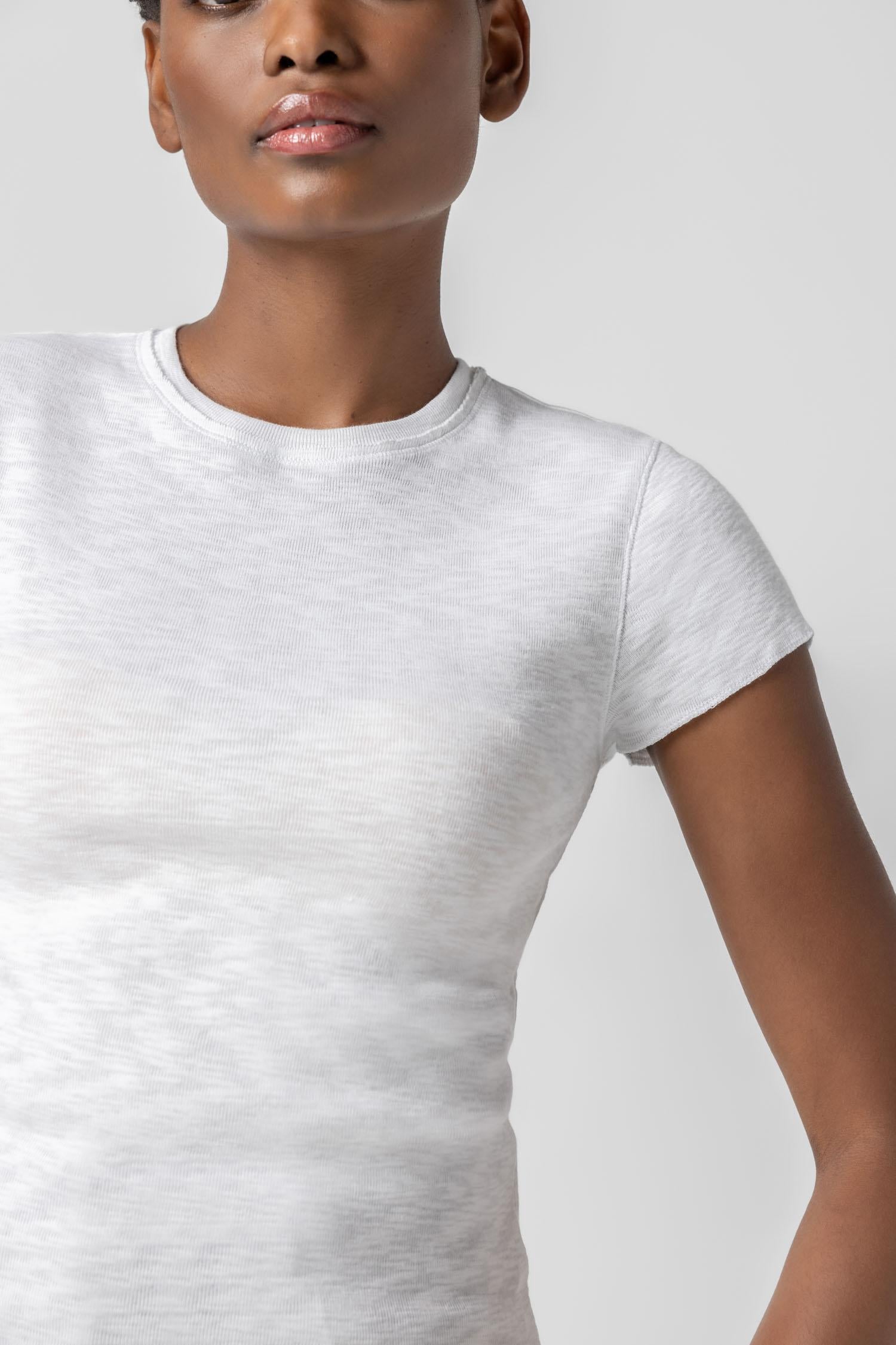 <p>This Striped Crewneck is a timeless tee with a slim shape designed to fit close to the body. Available in solid black and white, as well as three striped colorways, this classic silhouette is an essential addition to any wardrobe—proving that the perfect tee just got even better!</p> Womens Top White A1