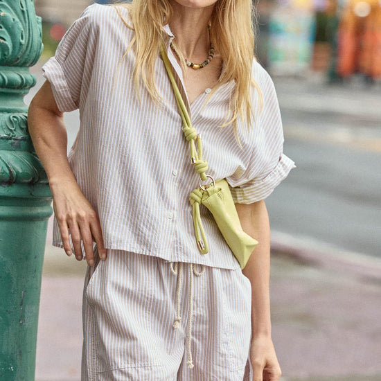 <p>In crisp poplin, the Striped Boxy Button Down features an oversized fit and shorter length for a relaxed, effortless look. The messy rolled cuffs add to its casual look, making it an easy choice for warm days. Pair it with the coordinating Striped Pocket Short for a head-to-toe look, or style it with one of our Air Textured Cotton bottoms for a balanced solid option.</p> Womens Top Flax Stripe C1