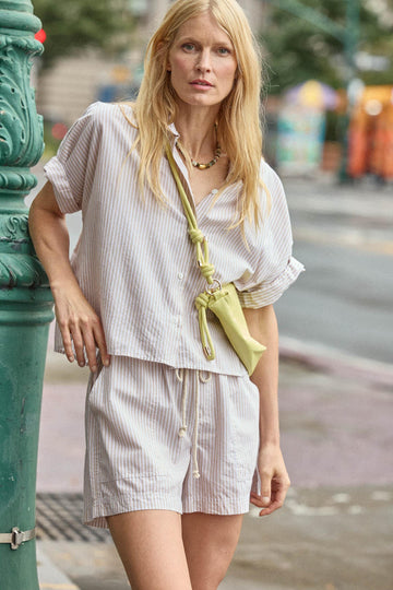 <p>In crisp poplin, the Striped Boxy Button Down features an oversized fit and shorter length for a relaxed, effortless look. The messy rolled cuffs add to its casual look, making it an easy choice for warm days. Pair it with the coordinating Striped Pocket Short for a head-to-toe look, or style it with one of our Air Textured Cotton bottoms for a balanced solid option.</p> Womens Top Flax Stripe C1