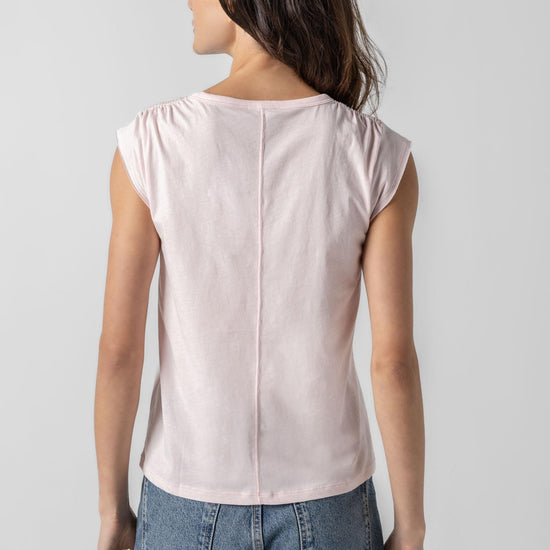 <p>In our Soft Wash Jersey fabric, the Shirred Shoulder Tee is both feminine and versatile for warm summer days. With a small cap sleeve and elastic with delicate shirring at the shoulder, itâ€™s designed to skim the body without being too fitted. Perfectly simpleâ€”yet anything but basic.</p> Womens Top Blush A2