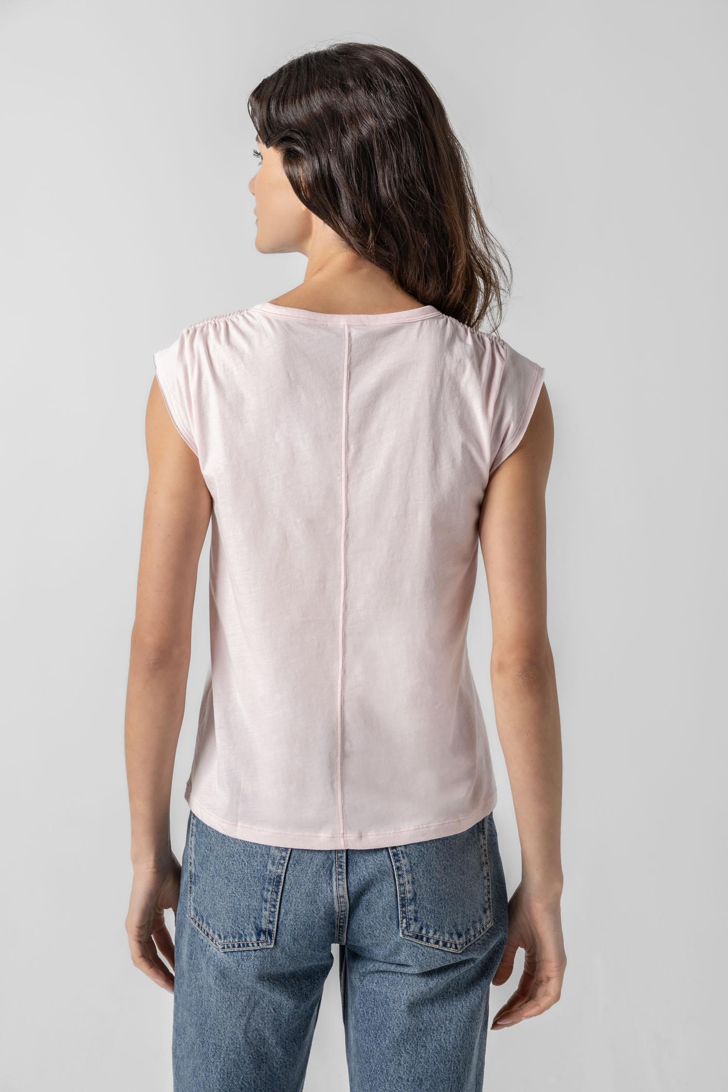 <p>In our Soft Wash Jersey fabric, the Shirred Shoulder Tee is both feminine and versatile for warm summer days. With a small cap sleeve and elastic with delicate shirring at the shoulder, itâ€™s designed to skim the body without being too fitted. Perfectly simpleâ€”yet anything but basic.</p> Womens Top Blush A2