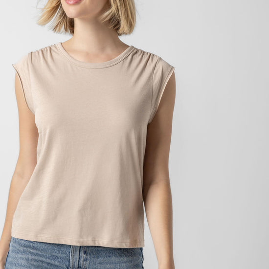 <p>In our Soft Wash Jersey fabric, the Shirred Shoulder Tee is both feminine and versatile for warm summer days. With a small cap sleeve and elastic with delicate shirring at the shoulder, itâ€™s designed to skim the body without being too fitted. Perfectly simpleâ€”yet anything but basic.</p> Womens Top Flax A1