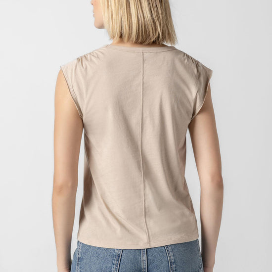 <p>In our Soft Wash Jersey fabric, the Shirred Shoulder Tee is both feminine and versatile for warm summer days. With a small cap sleeve and elastic with delicate shirring at the shoulder, itâ€™s designed to skim the body without being too fitted. Perfectly simpleâ€”yet anything but basic.</p> Womens Top Flax A2