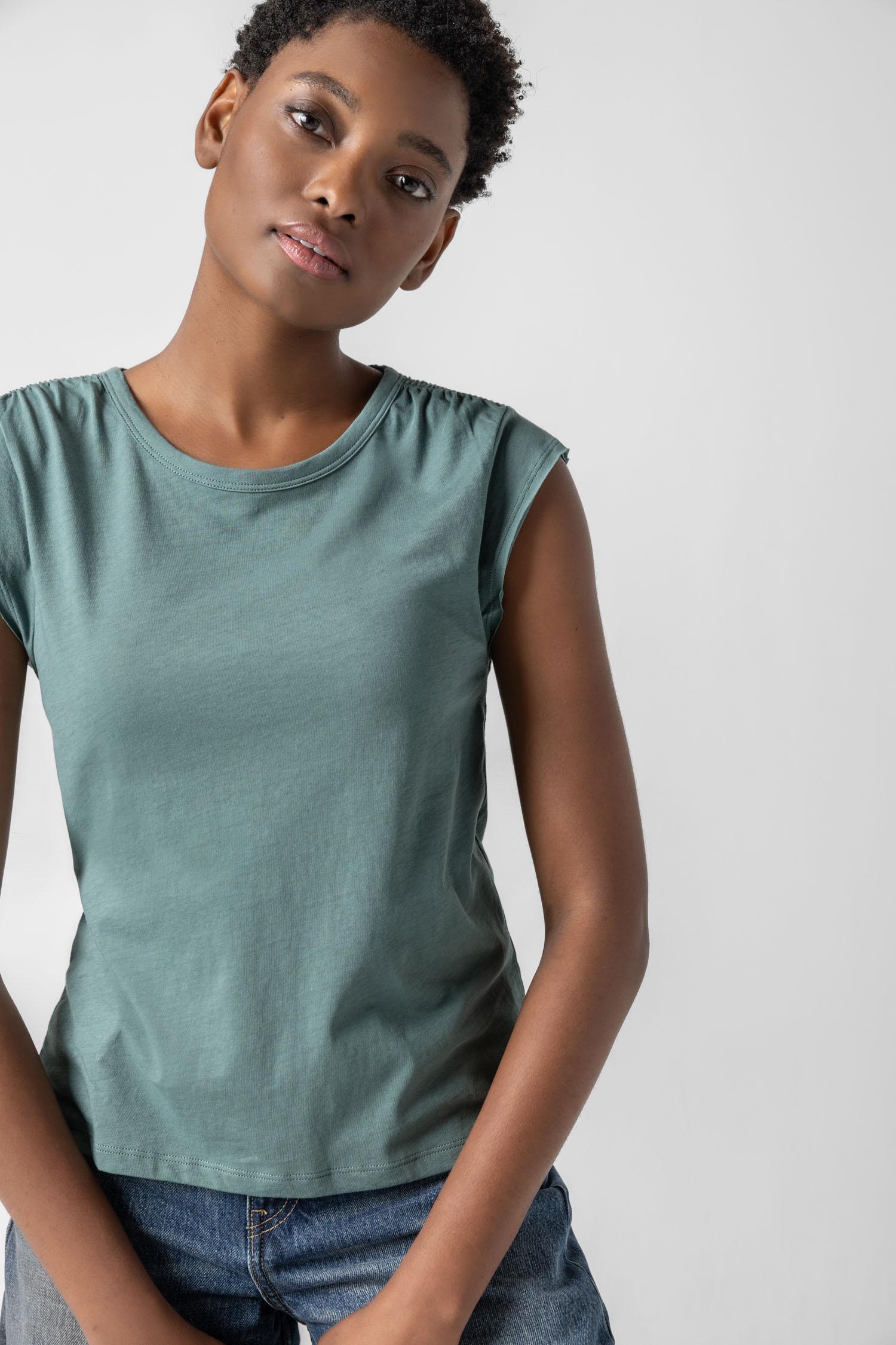 <p>In our Soft Wash Jersey fabric, the Shirred Shoulder Tee is both feminine and versatile for warm summer days. With a small cap sleeve and elastic with delicate shirring at the shoulder, itâ€™s designed to skim the body without being too fitted. Perfectly simpleâ€”yet anything but basic.</p> Womens Top Vine A2