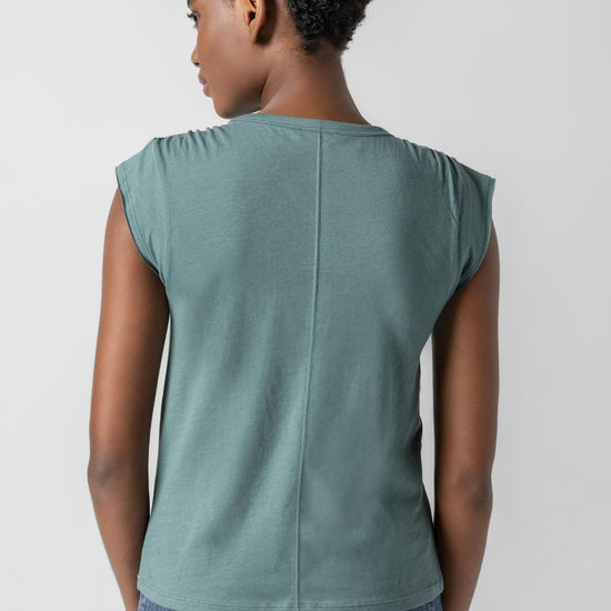 <p>In our Soft Wash Jersey fabric, the Shirred Shoulder Tee is both feminine and versatile for warm summer days. With a small cap sleeve and elastic with delicate shirring at the shoulder, itâ€™s designed to skim the body without being too fitted. Perfectly simpleâ€”yet anything but basic.</p> Womens Top Vine A3